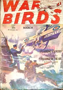 A biplane dives towards men on a surfaced submarine