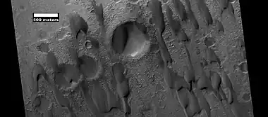 Dunes among craters, as seen by HiRISE under HiWish program.  Some of these dunes are Barchans.  Research published in Icarus stated that the dunes in Hershel Crater moved  0.8 m  in a time span of 3.7 Earth-years. Also, it was determined that dune ripple moved 1.1 m in that time period.  Other dunes may exhibit a similar amount of movement.