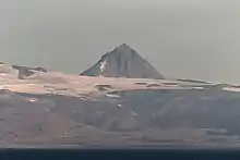 Pogramni (6,569 ft; 2,002 m) volcano as seen from the Unimak Pass in the morning light.